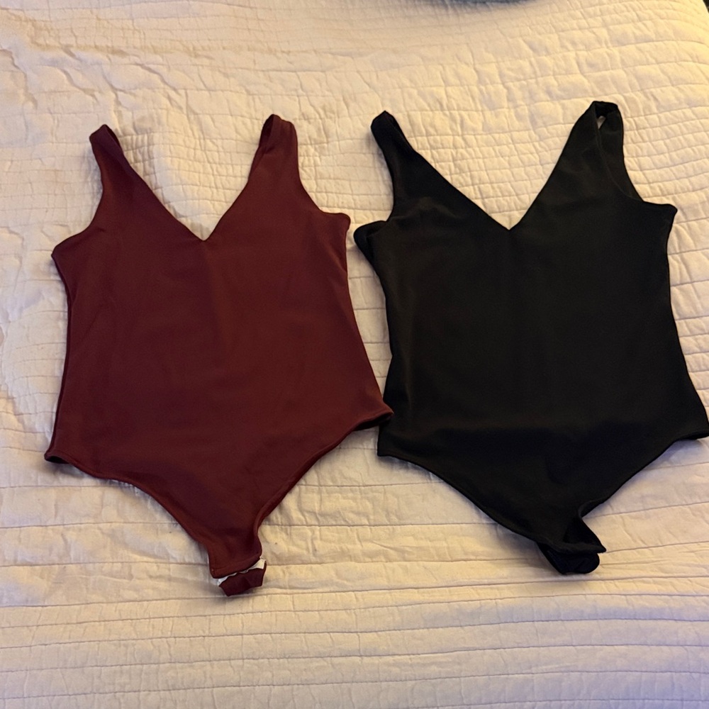 Two Deep V bodysuits - Black and Burgundy